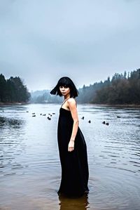 Woman standing in lake