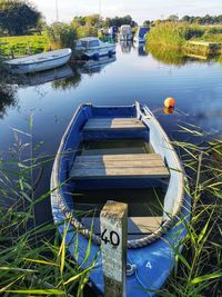 High angle view of boats moored in lake