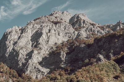 Rock formation on land against sky