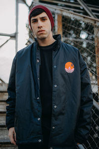 Portrait of young man standing outdoors