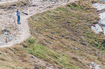 High angle view of man walking on land