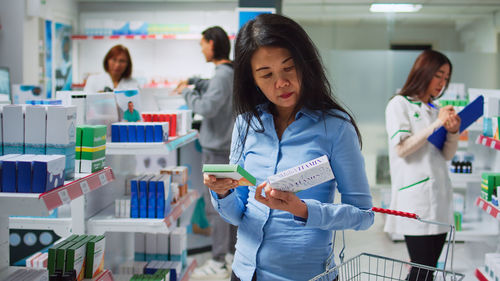 Portrait of young woman working in office