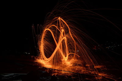 Light painting against sky at night