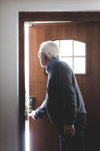 Doctor opening door of home office