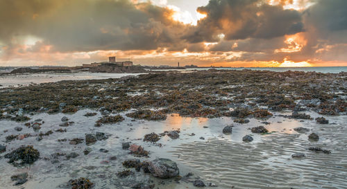 Scenic view of sea against sky during sunset