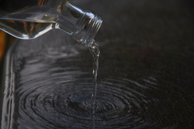 Close-up of water splashing in glass