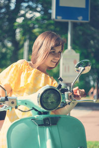 Portrait of young woman in bus