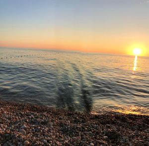 Scenic view of sea against sky during sunset