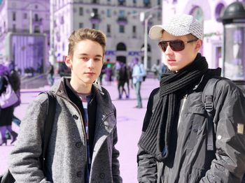 Portrait of young man wearing sunglasses in store
