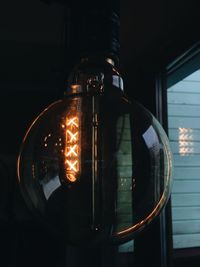 Close-up of illuminated light bulb
