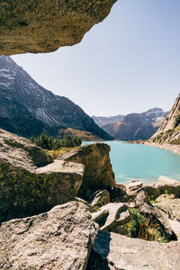 Scenic view of lake and mountains against clear sky