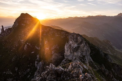 Scenic view of mountains against sky during sunset