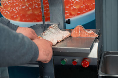 Cropped hand of person preparing food