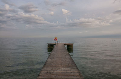 Pier over sea against sky