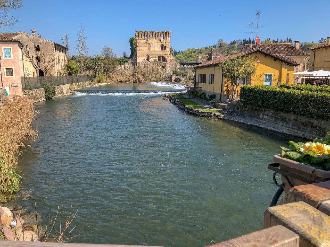 VIEW OF BUILDINGS BY RIVER IN TOWN