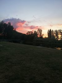 Scenic view of field against sky during sunset