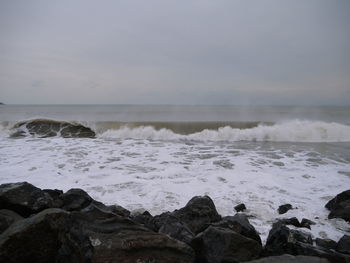 View of calm beach against the sky
