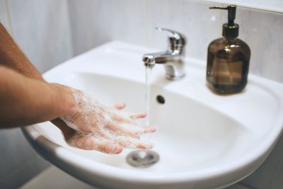 Midsection of man in bathroom