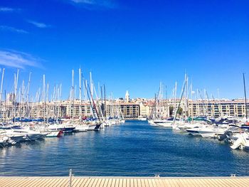 Boats moored at harbor