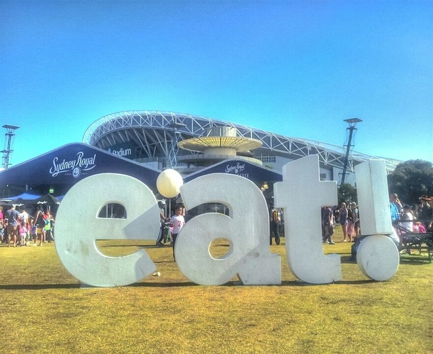 clear sky, transportation, copy space, blue, mode of transport, built structure, architecture, land vehicle, sunlight, outdoors, day, field, stationary, sky, car, building exterior, no people, travel, amusement park, industry