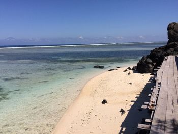 View of beach against clear sky