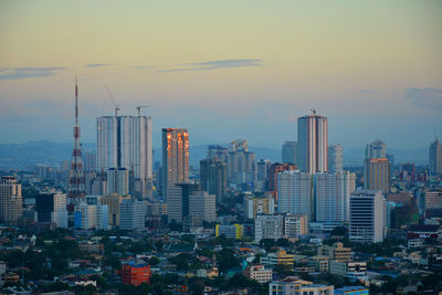 Modern buildings in city against sky