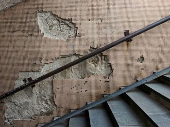 Close-up of metal railing against wall