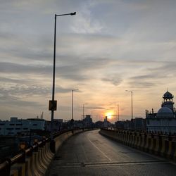 Street lights in city during sunset