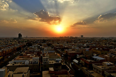 High angle view of townscape against sky during sunset