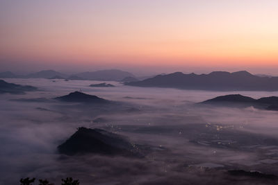 Scenic view of mountains against sky during sunset