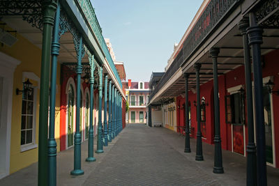 Empty alley amidst buildings in city