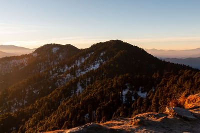 Scenic view of mountains against sky during sunset