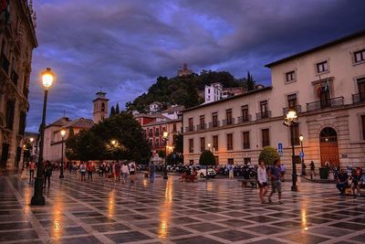 People in town square at night