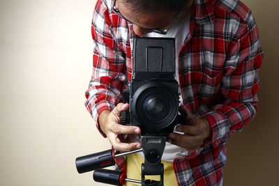 Midsection of man photographing