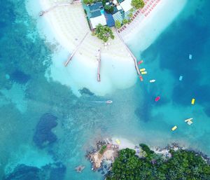 High angle view of people swimming in sea