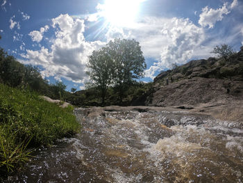 Scenic view of stream against sky