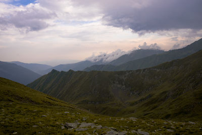 Scenic view of fagaras mountains against cloudy sky