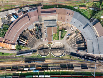 Aerial photo of semicircular railway depot. near round railway turntable for turning wagons.