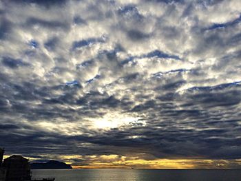 Scenic view of sea against cloudy sky