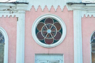 Low angle view of ornate window on building