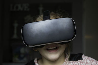 Close-up of girl wearing virtual reality stimulator