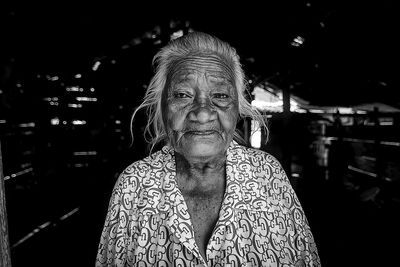 Portrait of woman standing outdoors