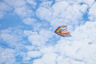 Low angle view of kite flying against sky