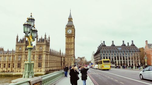 People walking on westminster bridge by big ben