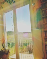 Close-up of hand against window
