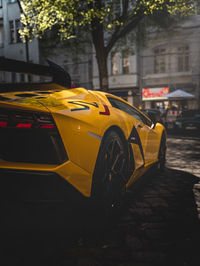 Yellow car on street in city