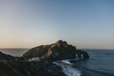 Scenic view of sea against clear sky during sunset