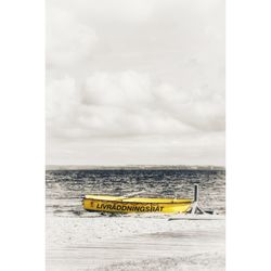 Yellow ship in sea against sky