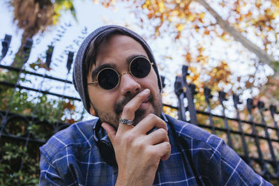 Portrait of young man wearing sunglasses