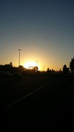 Silhouette landscape against clear sky